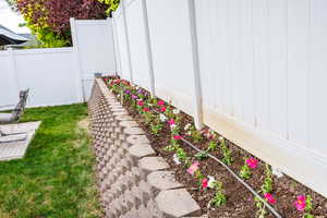 View of yard featuring fence