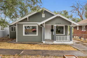 Bungalow-style house with a porch and board and batten siding