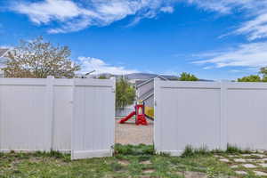 View of gate with a mountain view and fence