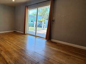 Living room on main with sliding glass doors out to the south facing deck
