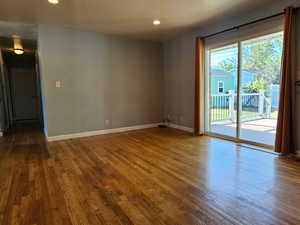 Living room on main with sliding glass doors out to the south facing deck