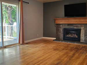 Living room with sliding glass door to the deck and a gas fireplace