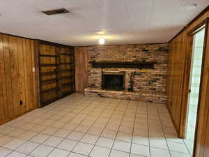 Family room down, wood buring fireplace and tile floors