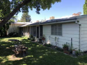 Exterior space featuring a yard