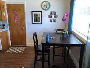 Dining area featuring baseboards and wood finished floors