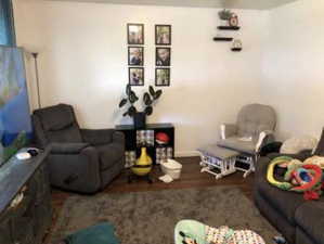 Living room featuring baseboards and wood finished floors