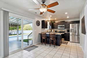 Kitchen with sliding door out to yard and pool