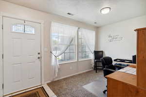 Front door. Entry area is currently being used as office
