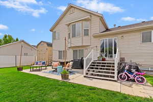 Back of property featuring an outdoor living space and a patio area