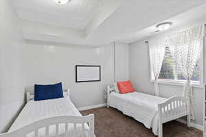 Bedroom featuring carpet flooring.