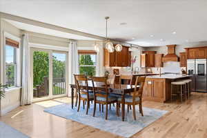 Dining space with recessed lighting, baseboards, and light wood-style floors
