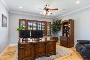 Office featuring ceiling fan, baseboards, ornamental molding, recessed lighting, and light wood-style flooring