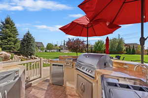 View of patio / terrace with area for grilling and a grill