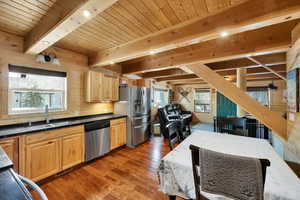 Kitchen with a sink, light brown cabinets, plenty of natural light, and stainless steel appliances
