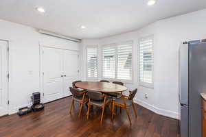 Dining space featuring recessed lighting, dark wood-style floors, and baseboards