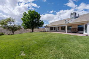 View of yard featuring central AC unit and a patio area