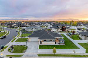 Aerial view at dusk with a residential view and a mountain view