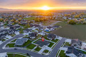 Aerial view at dusk featuring a mountain view and a residential view