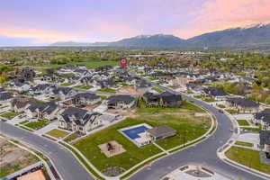 Aerial view at dusk featuring a mountain view and a residential view