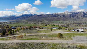 Property view of mountains with a water view