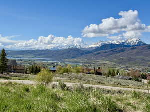South view featuring a water view and Snowbasin mountain peaks.