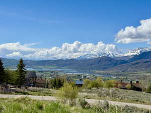 Property south view of mountains featuring a water view.