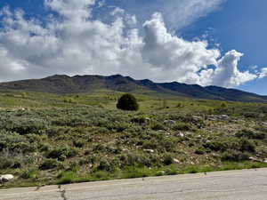 Ground view looking north at mountains across from the front of the lot.