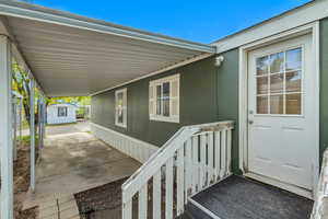 Property entrance with an attached carport