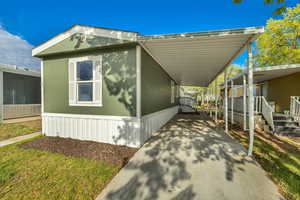 Exterior space featuring an attached carport