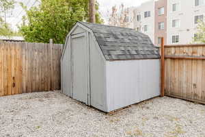 View of shed featuring a fenced backyard
