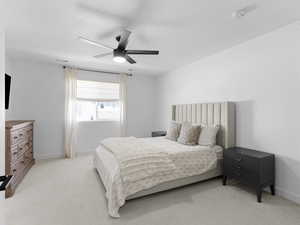 Master Bedroom with baseboards, visible vents, a ceiling fan, and light colored carpet