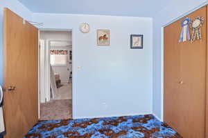 Unfurnished bedroom featuring carpet floors