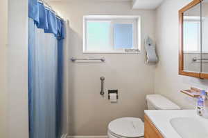 Bathroom with vanity and toilet