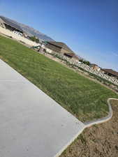 View of green lawn with a mountain view