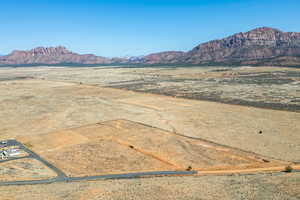 Property view of mountains with a rural view and a desert view