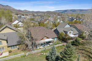 Birds eye view of property with a residential view and a mountain view