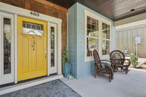 Entrance to property featuring a porch