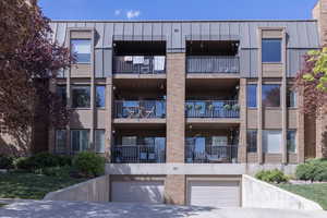 View of property with an attached garage