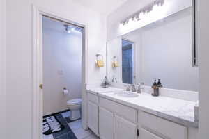 Bathroom featuring vanity and toilet