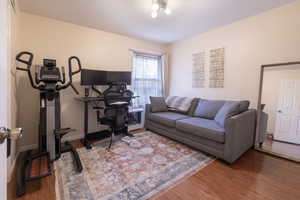 Living room with baseboards and wood finished floors
