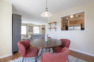 Dining room with baseboards and wood finished floors