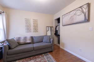 Living room with wood finished floors and baseboards