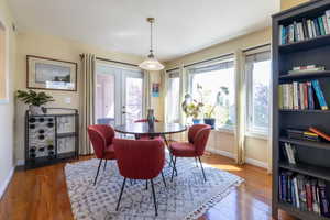 Dining space with wood finished floors and baseboards