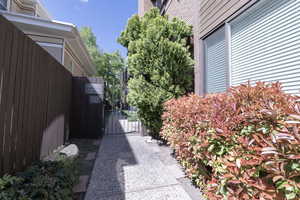 View of home's exterior with fence and a gate