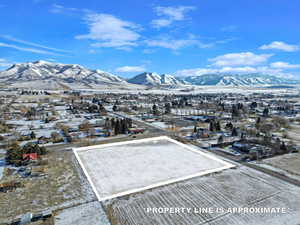 Drone / aerial view featuring a residential view and a mountain view