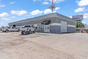 View of property with uncovered parking