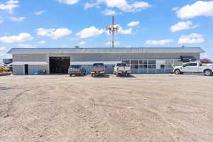 View of property with uncovered parking