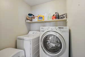 Laundry area featuring laundry area and independent washer and dryer
