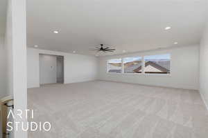 Spare room with light colored carpet, a ceiling fan, recessed lighting, and baseboards