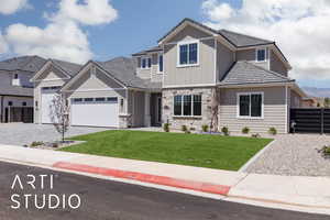 Craftsman-style home featuring a garage, stone siding, board and batten siding, driveway, and a tile roof